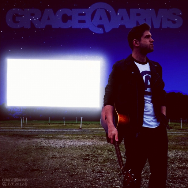 A poster of Bastion Crider of Grace at Arms (GRACE@ARMS) in front of the movie screen at the Skyvue Drive-In in New Castle, Indiana.  All art, logos, and design by Bastion, copyright Grace at Arms, Bastion Crider, and Greg Crider LLC.